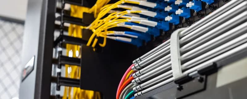 Fiber patch panel with color-coded jumpers in a tym2 data hall
